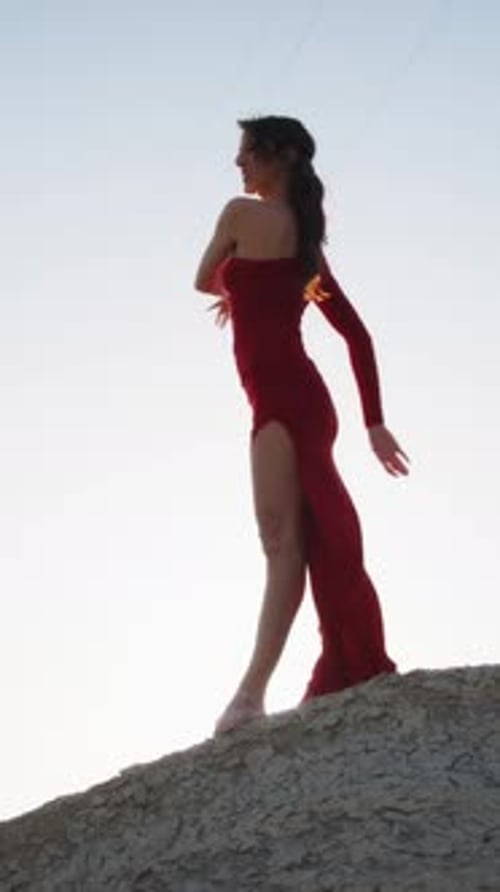 Dancer In Red Dress Moves Sinuously On The Hill In Sicily