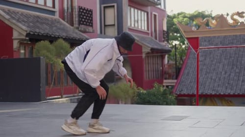 Young Man Breakdancing In Street Of Bangkok