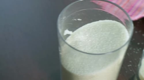 Sugar in Container. Sugar in Glass and Plastic Containers an Kitchen Table