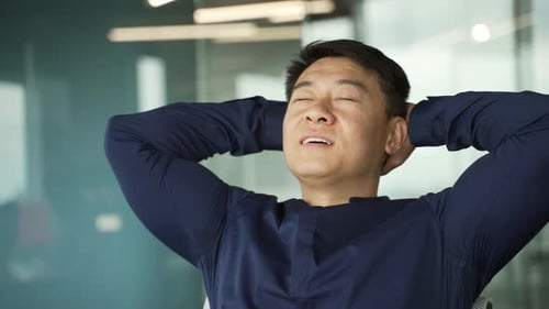 Relaxing Man Taking a Break in Workplace