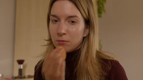 Woman Applies Makeup Foundation With Sponge Close Up