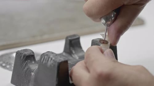 Creating Dental Crown with Precision Instrument Close Up