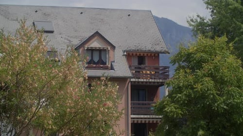 House with Balcony and Attic Window