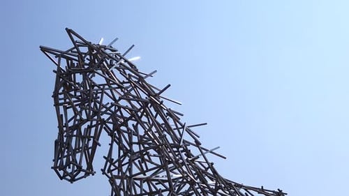 Abstract Horse Sculpture Against Clear Blue Sky