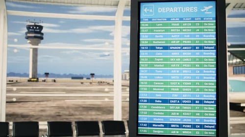Quiet Airport Terminal Waiting Area with No Passengers and Departures Board