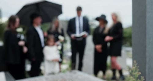 Outdoor, funeral or family with bible at cemetery, memorial service or scripture for religious