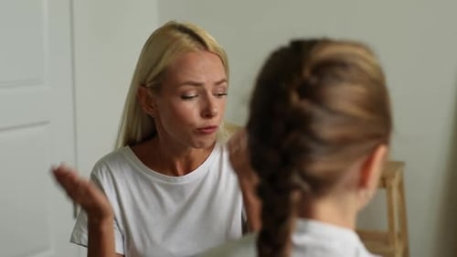 View From Shoulder Unrecognizable Preteen Girl to Angry Young Mother Scolding Raising Voice Shouting