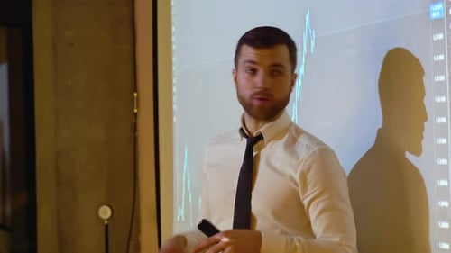 Presentation Event Businessman Talks of Sales Growth in the Stock Market Showing TV Big Data