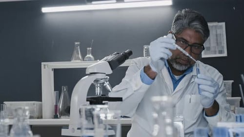 Scientist Conducting Experiment in a Bright Laboratory