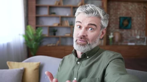 Friendly Man Waving and Talking on Video Call