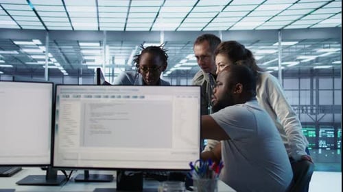 Multiethnic Team of Engineers Working in High Tech Server Hub