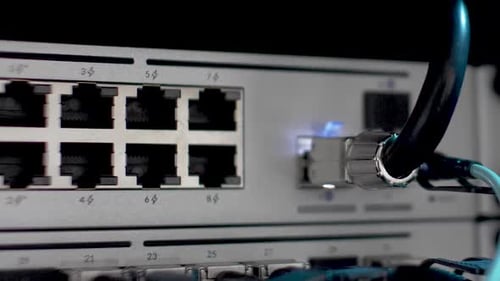 Back Of Server Network Server Rack With Blinking LED Lights. Close Up, Pan Shot