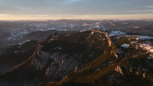 Aerial drone view of sunrise in the mountains. Ceahlau National Park, Romania