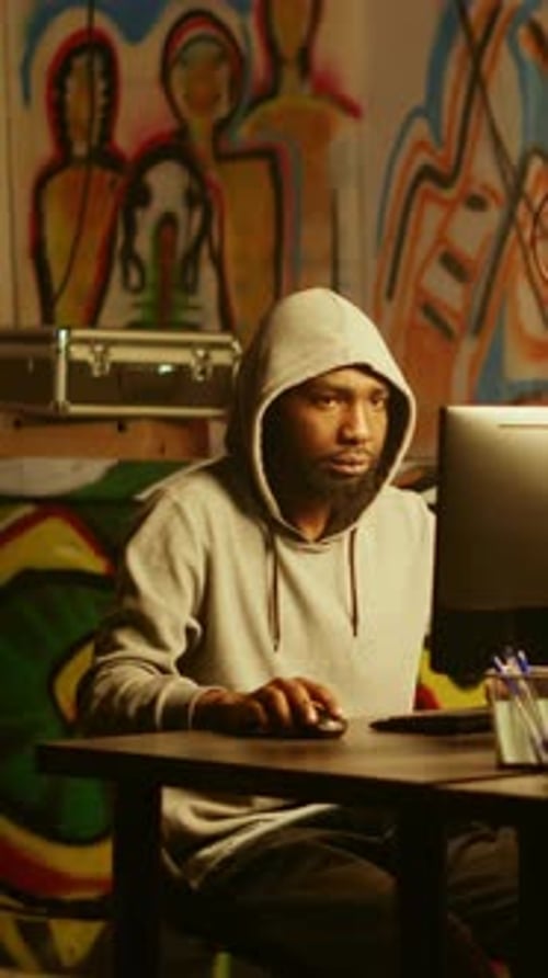 Young Adult Works at Computer Late at Night