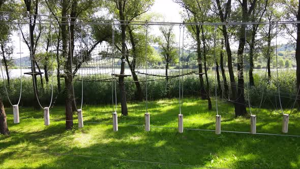 High ropes course feature between two tree platforms, Varbo, Hungary ...