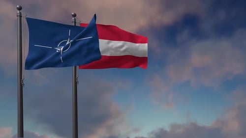 Waving NATO and Austria Flags Against a Cloudy Sky