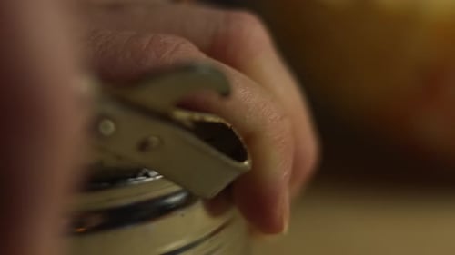 Opening a Can with a Can Opener