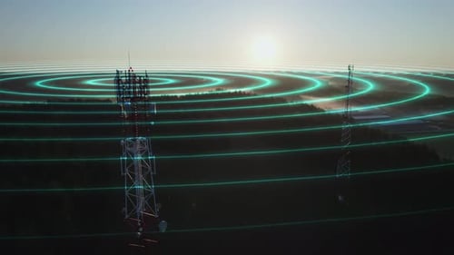 Aerial view of a 5G mobile network antenna emitting radio signals against the background of nature.