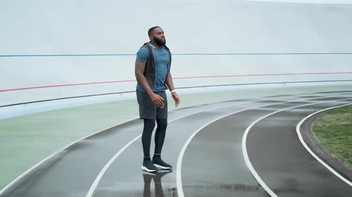 Afro Sportsman Doing High Jumps On Place At Sports Stadium. Energetic Athlete Training On Sports ...