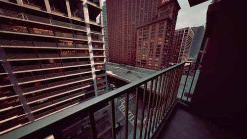 High-Angle City View From Balcony With Moving Traffic