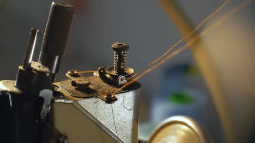 Close Up Of Sewing Machine Needle and Thread