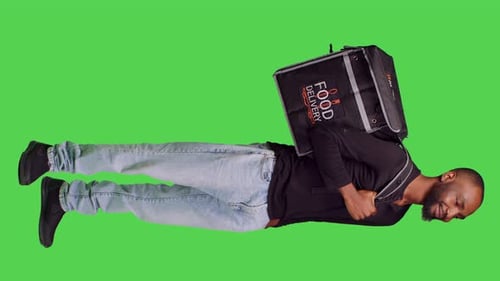 Vertical Video Side View of African American Person Working As Deliveryman on Camera