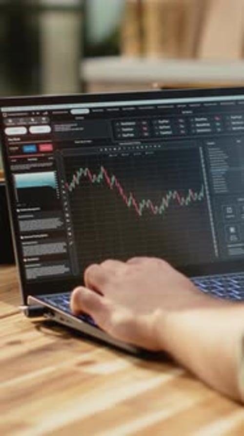 Vertical Video Male Investor Monitoring Day Trading Price Fluctuations and Market Trends