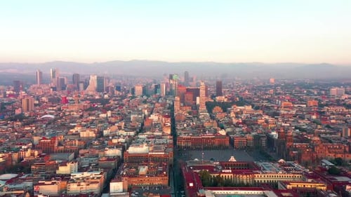 Aerial Drone View Of Vibrant Urban Cityscape Under Soft Sunset