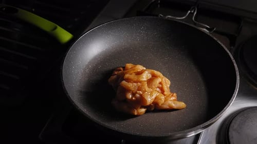 Cooking Skinless And Boneless Chicken Breast In A Skillet. close up