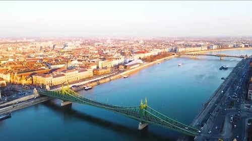 4K Aerial Drone View of Cityscape with Bridge Over the River