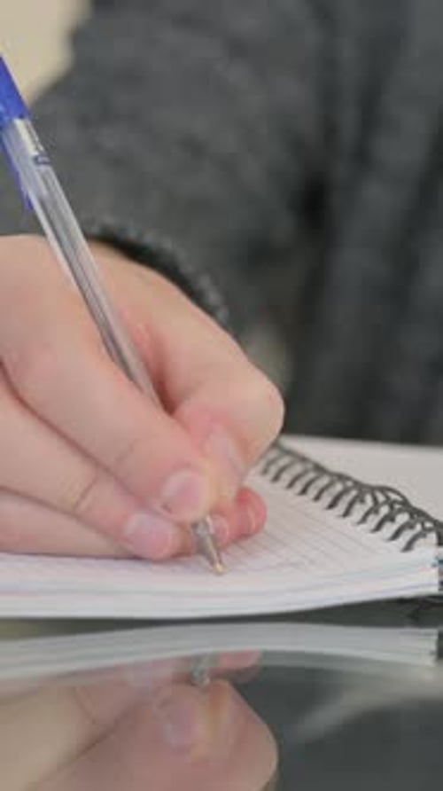 Close up of Man Writing a Diary, vertical video