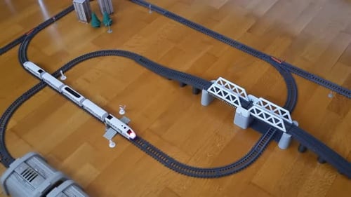 Top Down View on Plastic Toy Train Riding Railway Childish Toy Railway