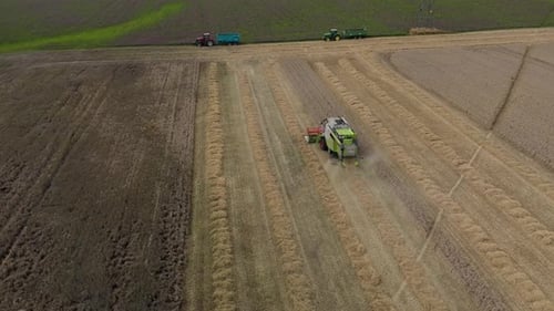 Aerial View of Harvesting Machines in Action