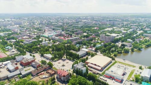 Aerial View of Cityscape with Green Trees