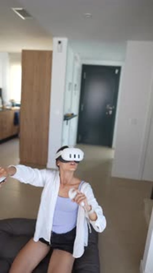 Woman Enjoys Immersive Virtual Reality Experience at Home