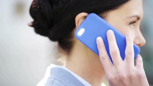 Woman Talking on Phone in City, Close Up