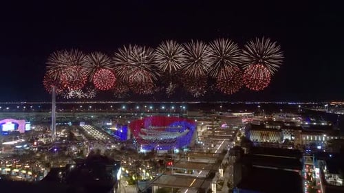 Video Expo Dubai at night with a fireworks show in the background