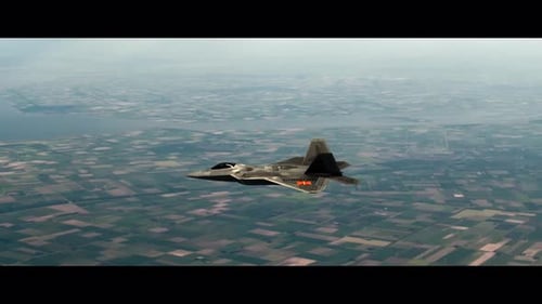 Stealth Fighter Jet Soaring Across Open Landscape