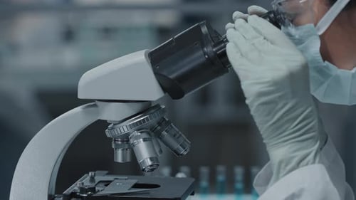 Female Lab Assistant with Microscope