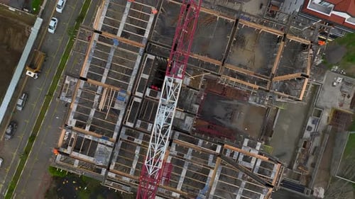 Aerial Video of Construction Workers and Tower Crane Activity