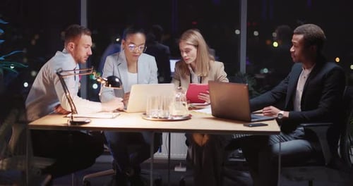 Creative Multiethnic Business Team of Smart Corporate Colleagues Sitting Together in Boardroom