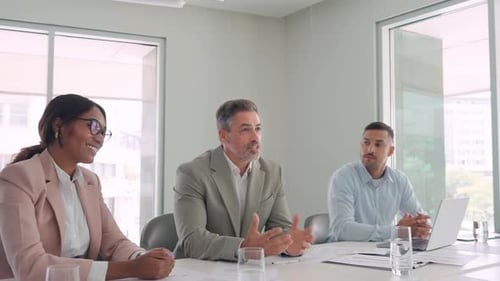 Happy International Executive Team Leaders Giving High Five at Meeting Table