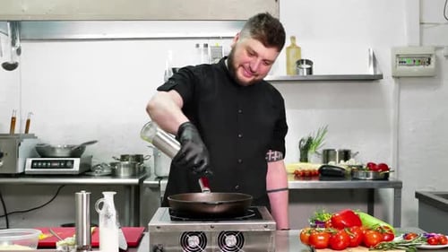 The Chef Pours Olive Oil in a Frying Pan to Make Pasta