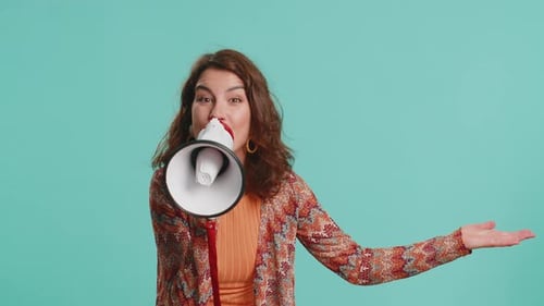 Woman Talking with Megaphone Proclaiming News Loudly Announcing Advertisement Pointing Empty Place