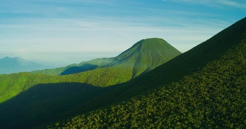Dramatic Sunset Sky Over Tropical Volcano in Indonesia