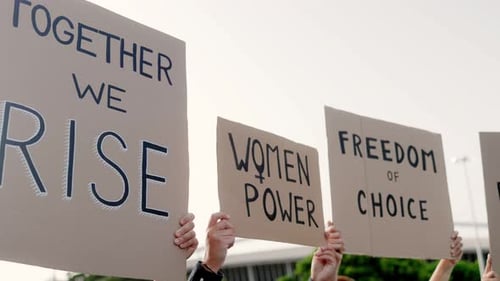 Protestors Holding Women's Rights Signs