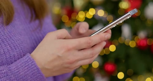 Closeup of Woman Holding Smartphone in Hands
