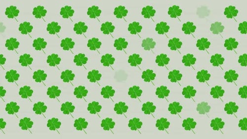 Digital animation of multiple clover leaves flickering against grey background
