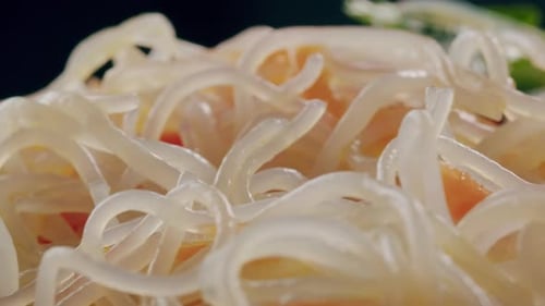 Glass Noodles Salad with Meat and Carrots Fermented Close Up Asian Chinese Traditional Food