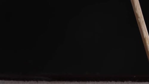 Matchstick Ignites in a Dark, Smokey Space